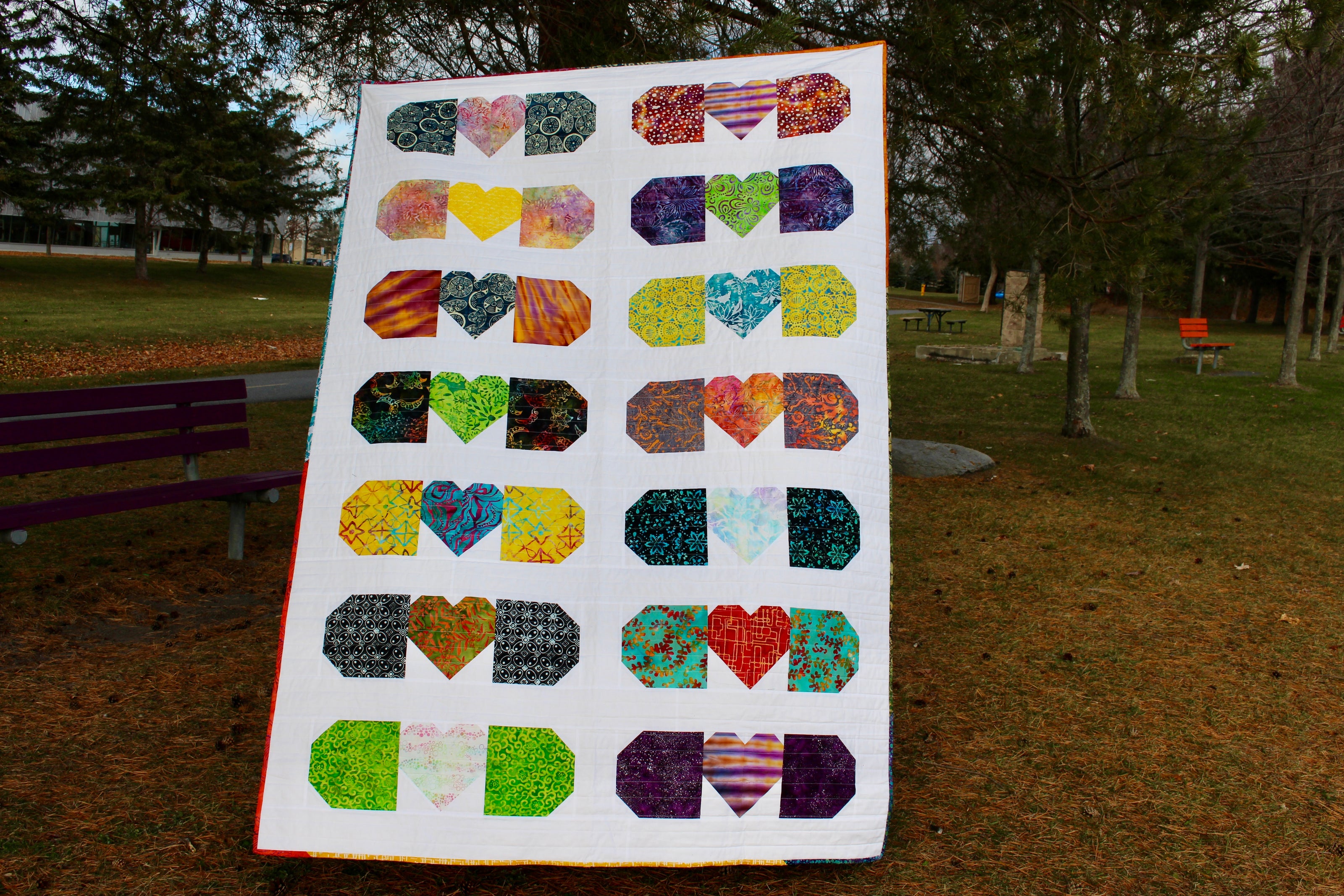 A quilt made with returned Ground Soap packaging. This one forms bandaids with hearts.