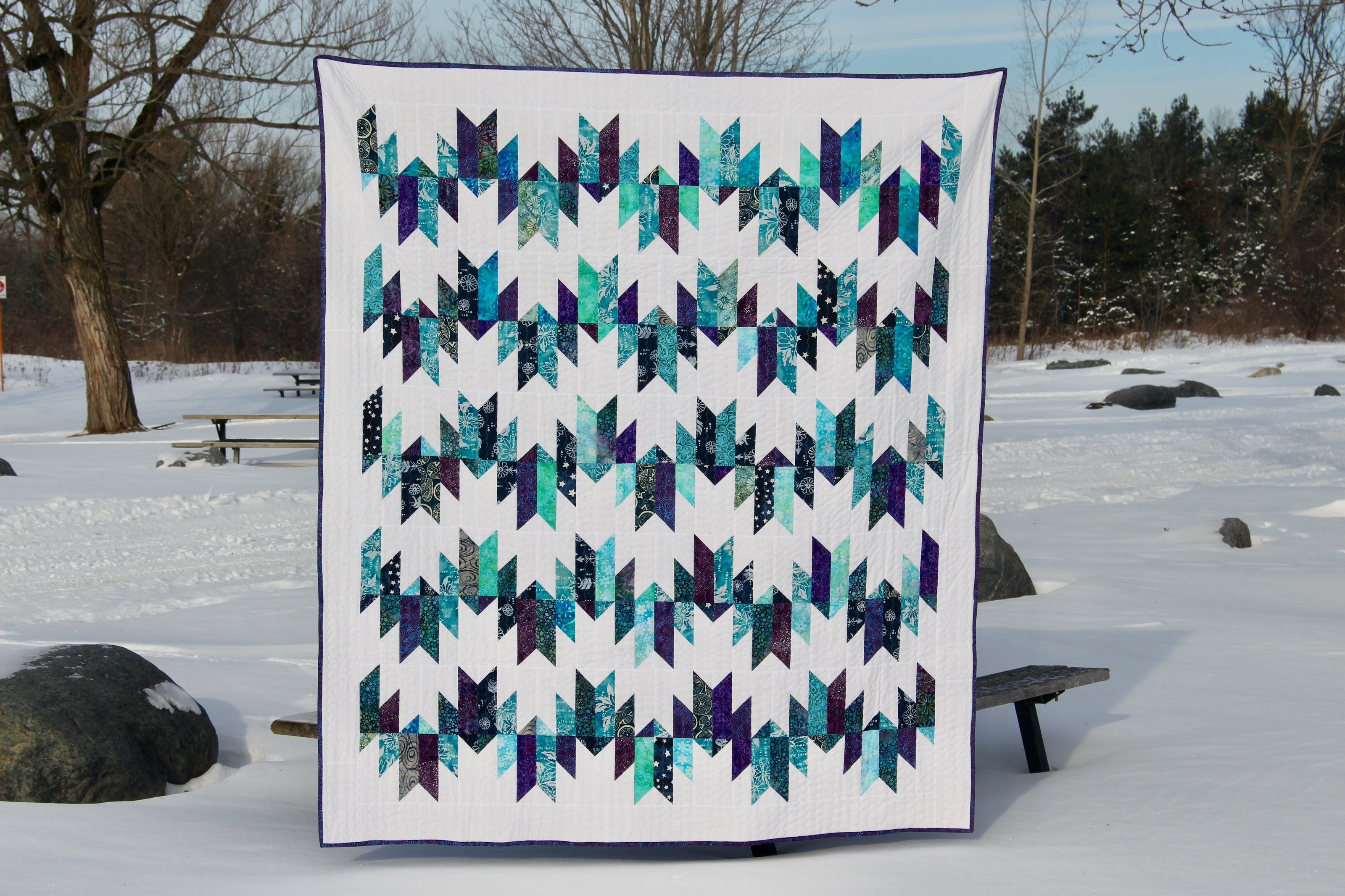 A quilt made with returned Ground Soap packaging. This one has blue tones.
