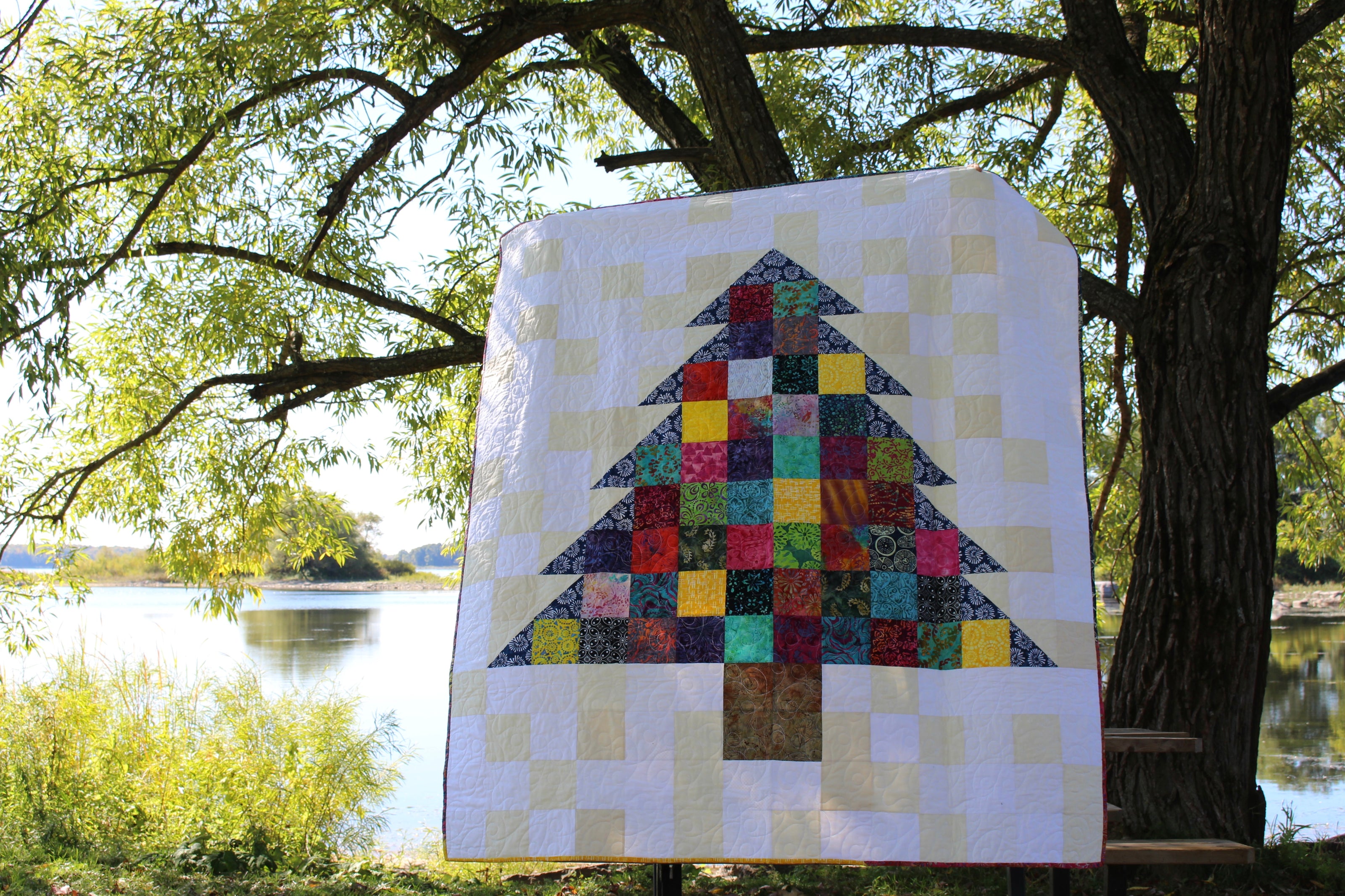 A quilt made with returned Ground Soap packaging. This one forms a tree in the middle.