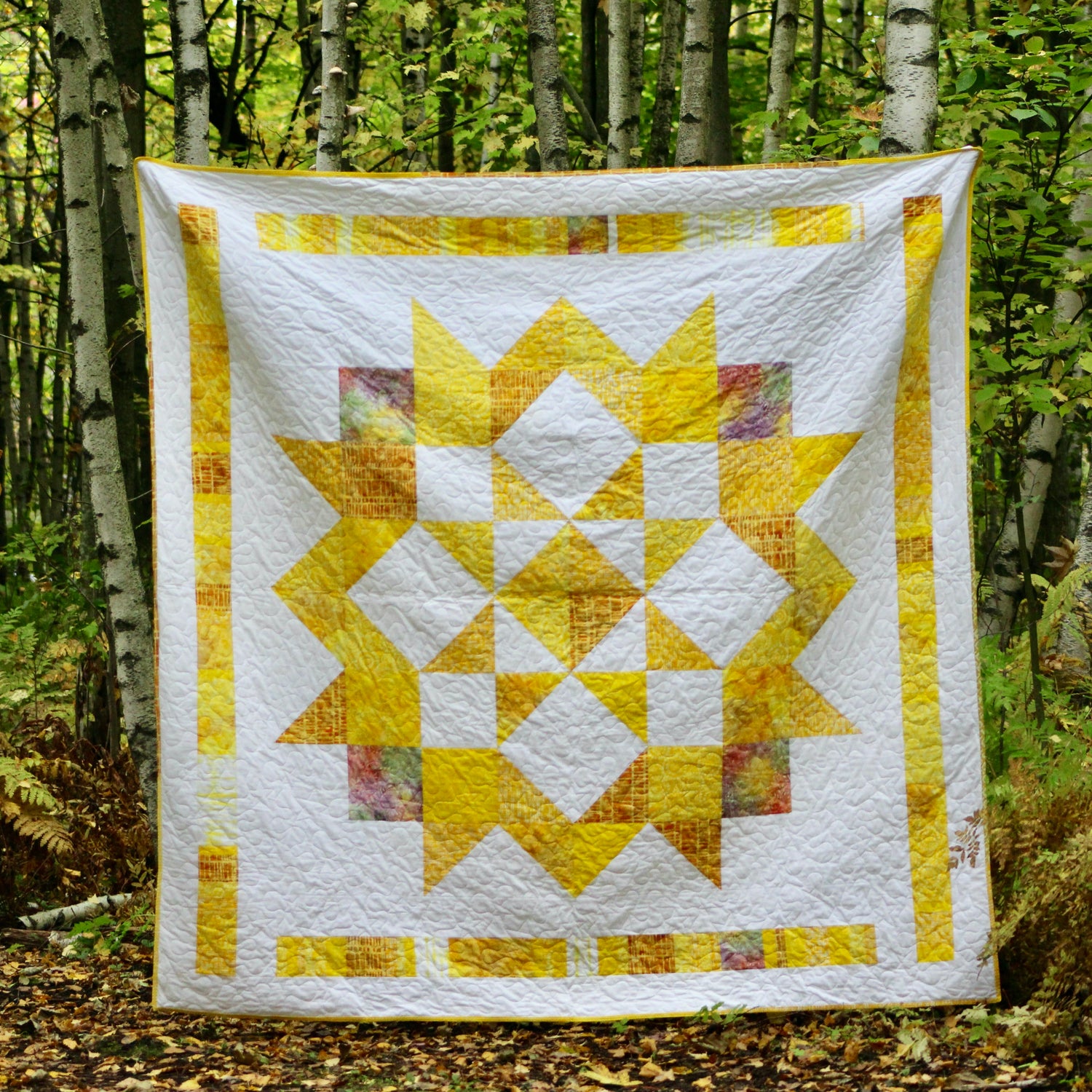 A vibrant quilt made with returned Ground Soap packaging.