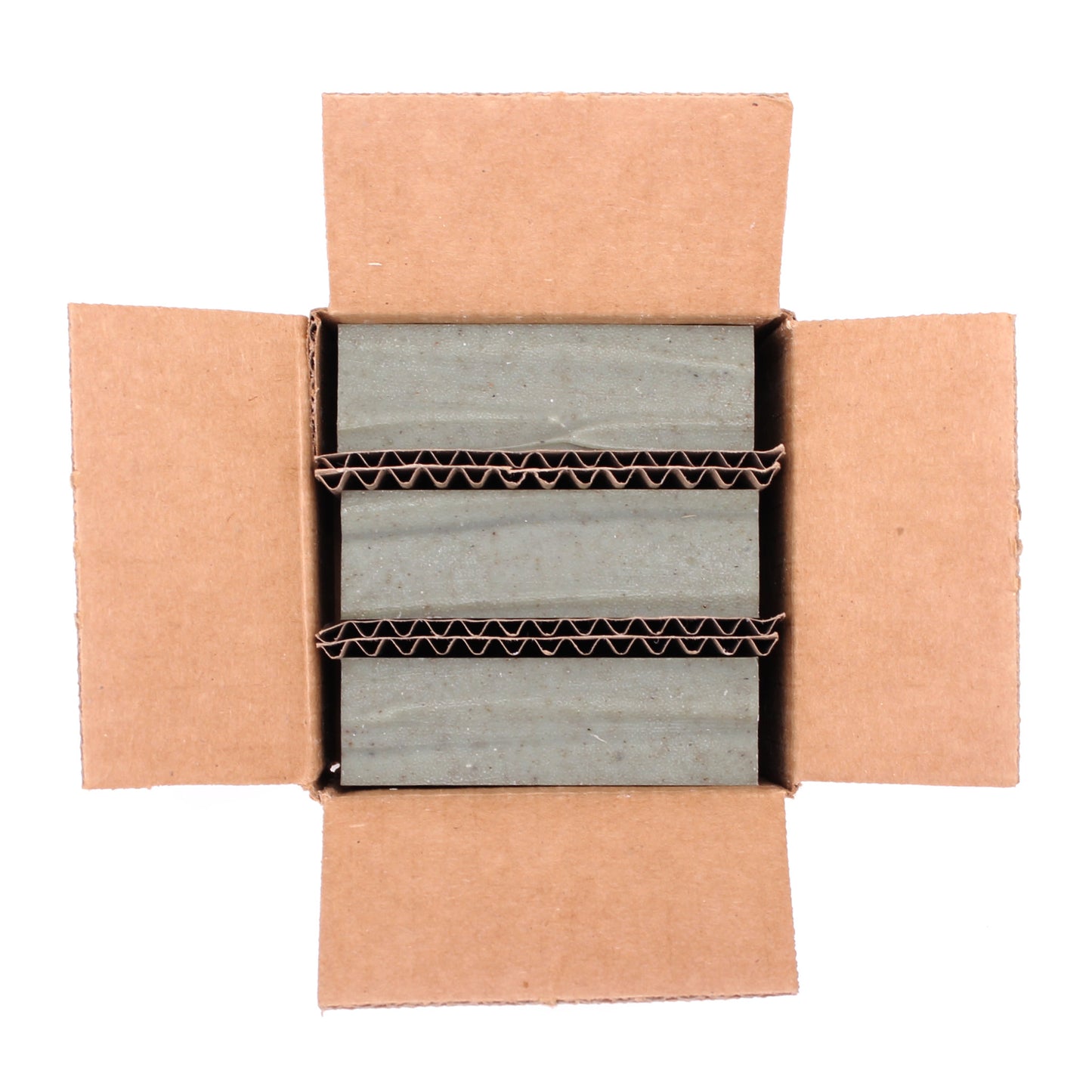 A naked three pack of Grove cedar & pine essential oil and rhassoul clay organic bar soap from ground Soap.