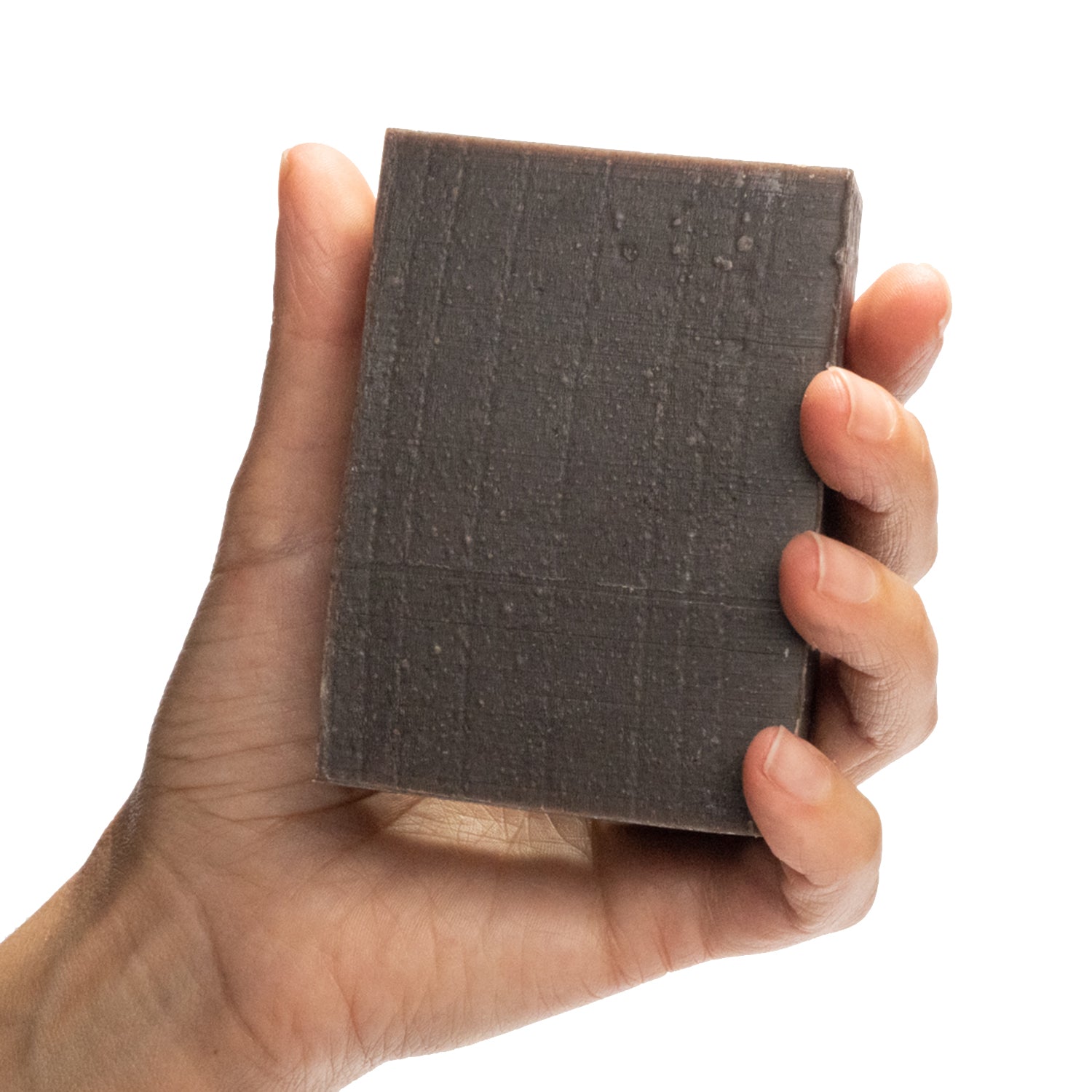 Black Cricket lavender essential oil organic bar soap from ground Soap in hand.