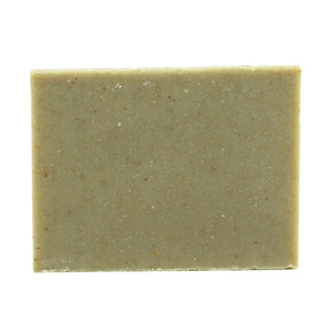A naked bar of "Grove" cedar & pine essential oil and rhassoul clay organic bar soap from ground Soap. 
