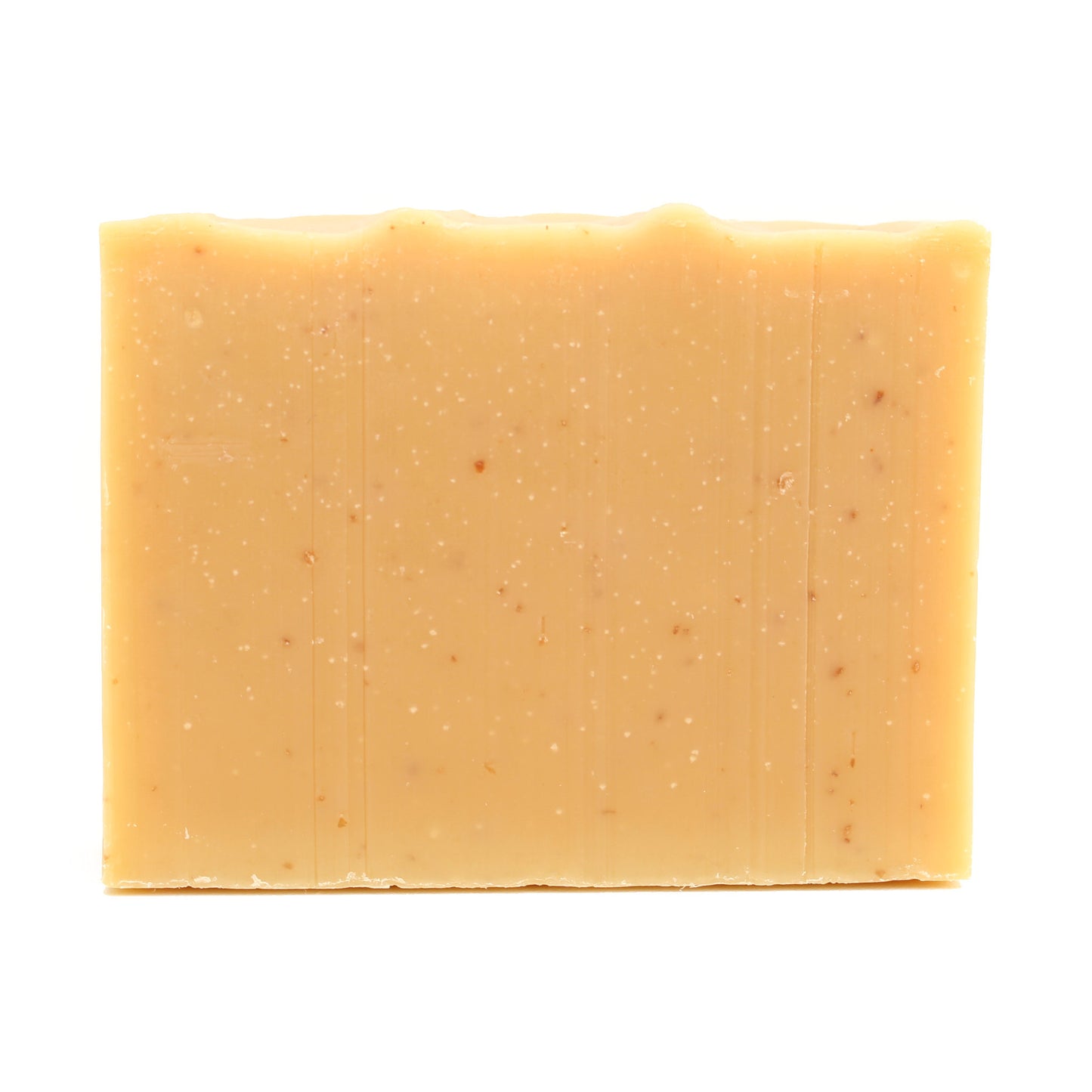 A naked bar of Lemme Bee Your Honey lemon essential oil and honey organic bar soap from Ground Soap.